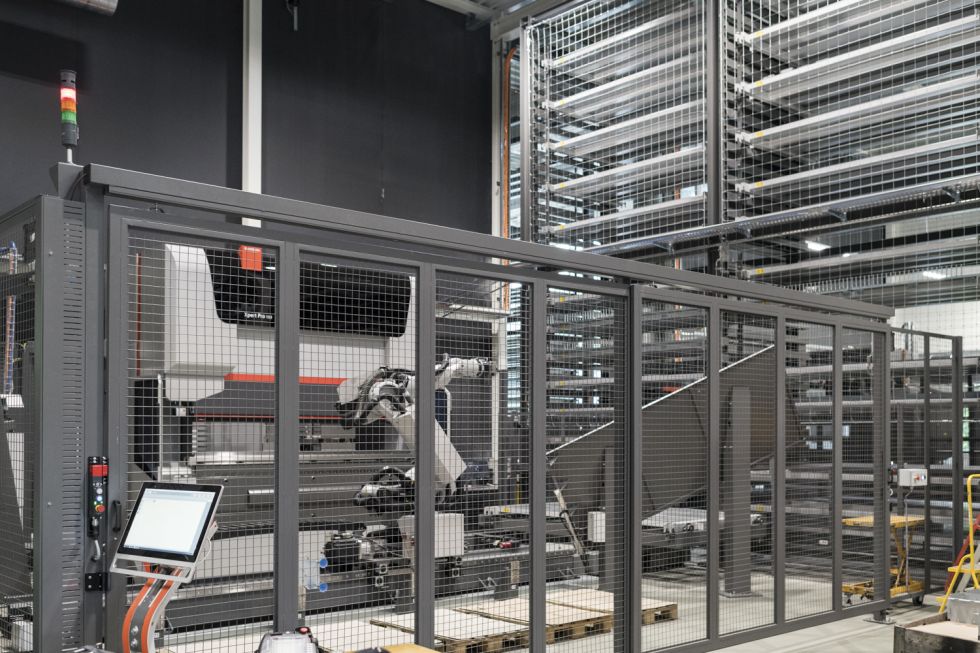 Employees on a touch screen to trigger the order after bending cell autonomous process orders.
